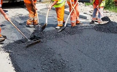 Why use asphalt instead of cement to pave roads